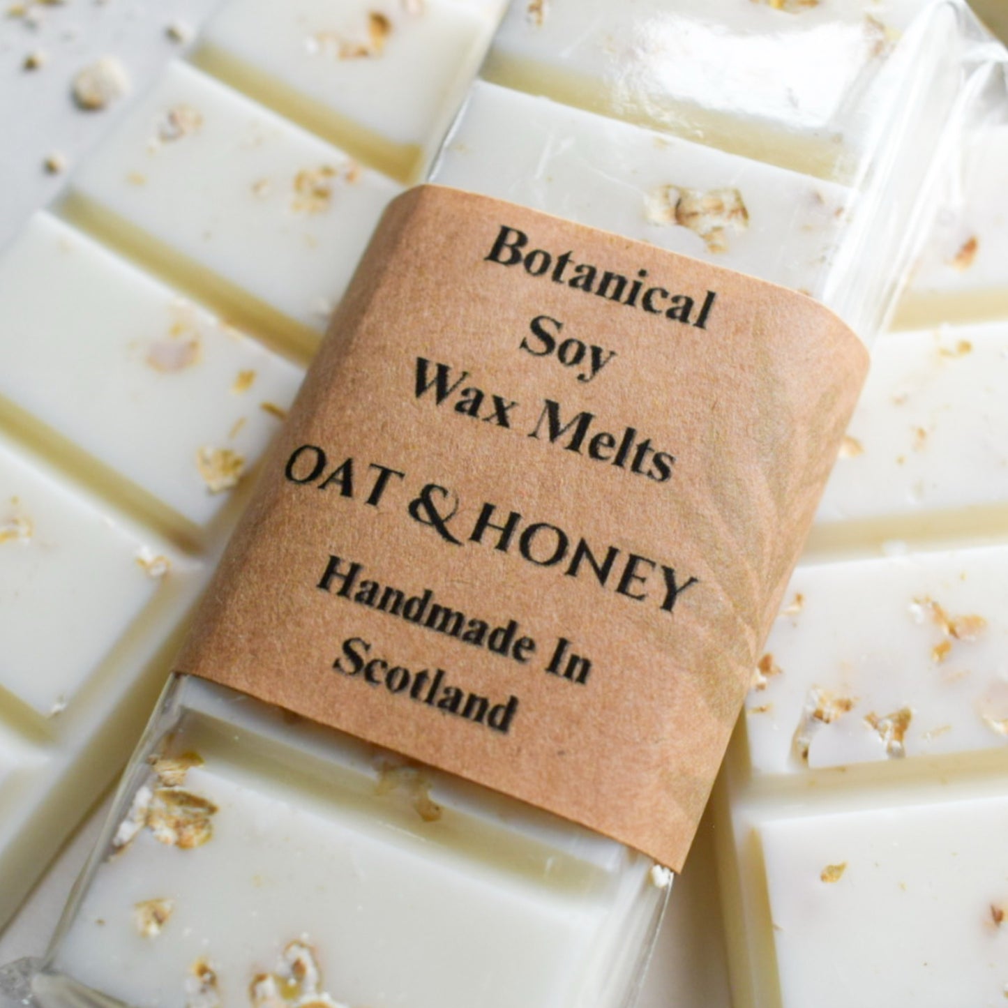 Botanical soy wax melts with oat and honey flavor, handmade in Scotland, on a white background.