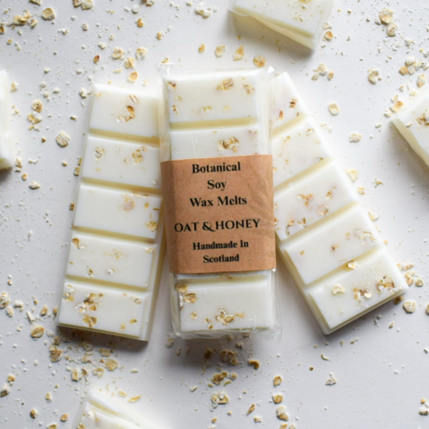 Bar of Botanical Soy Wax Melts with Oat & Honey label on a light background
