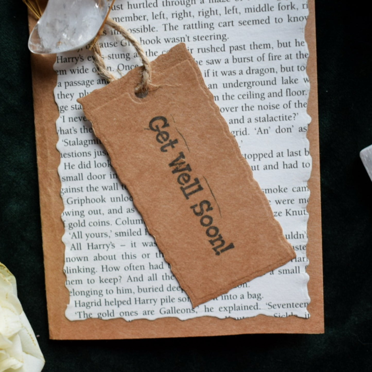 Brown paper tag with 'Get Well Soon!' text on a greeting card